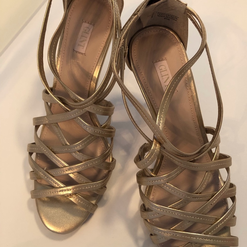 Gold Strap heels with zip up back.